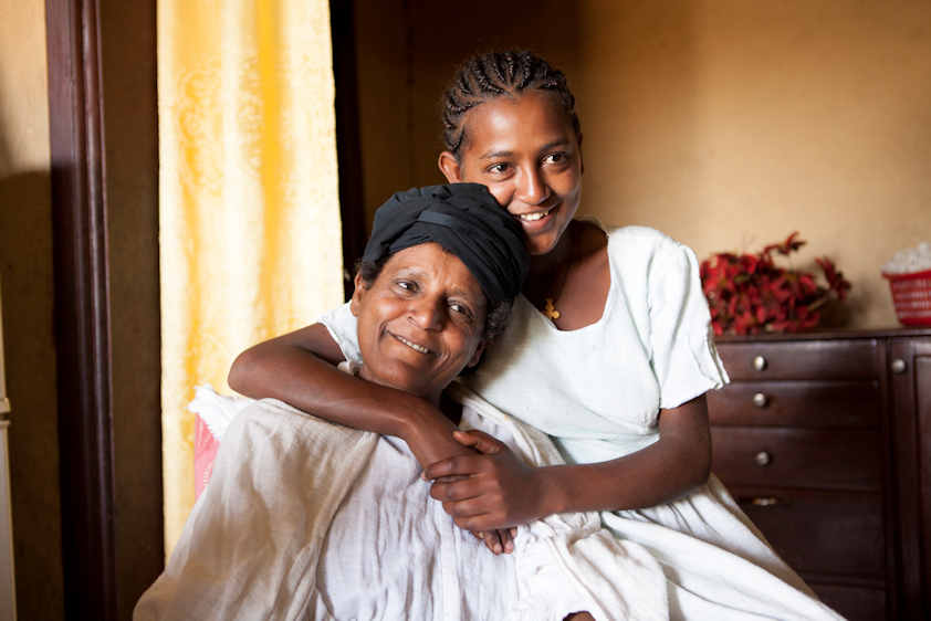 Grandmother with grandchild by Alexis MacDonald